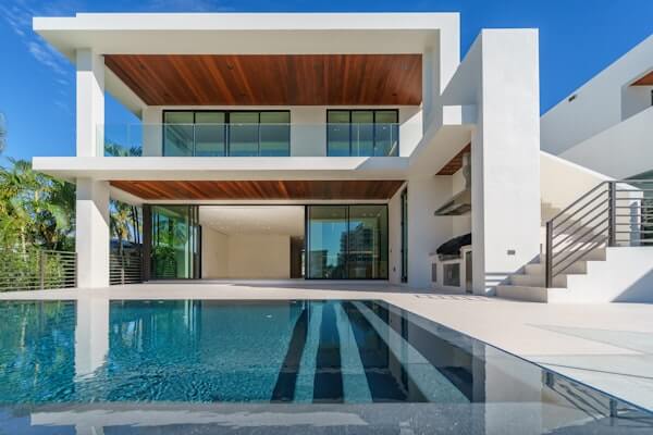 Stunning modern villa with a swimming pool at dusk