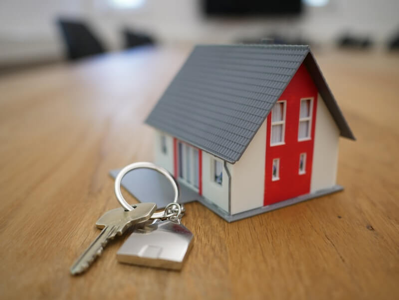 Happy couple with keys to a new home